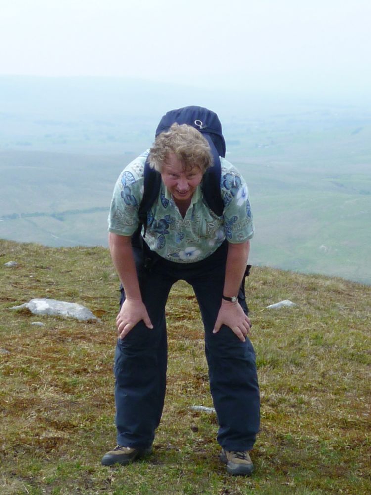Alex pauses for breath at the top of High Pike...